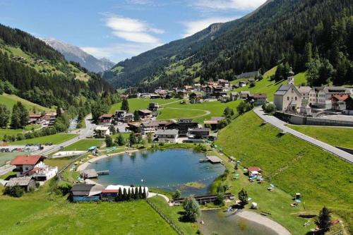 a small village in a valley with a lake at Haus Dominik in See