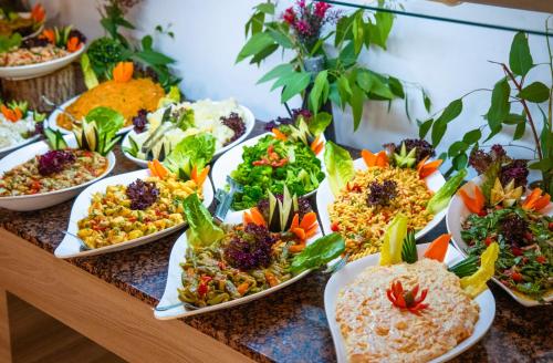 a buffet of different types of food on a table at Bezay Hotel in Fethiye