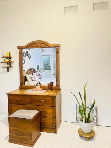 a bathroom with a sink and a mirror at Serene Stay Weligama in Weligama