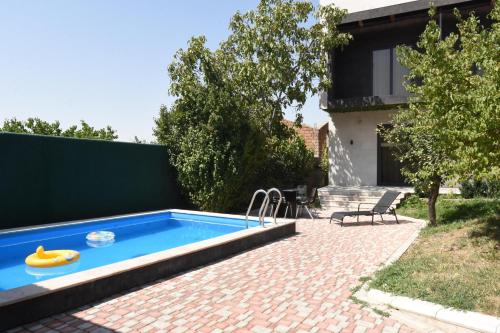 Private 2-storey home with a pool and grilling yard