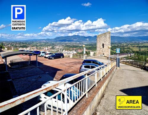 a parking lot with cars parked in a parking lot at Domus Santa Maria in Narni