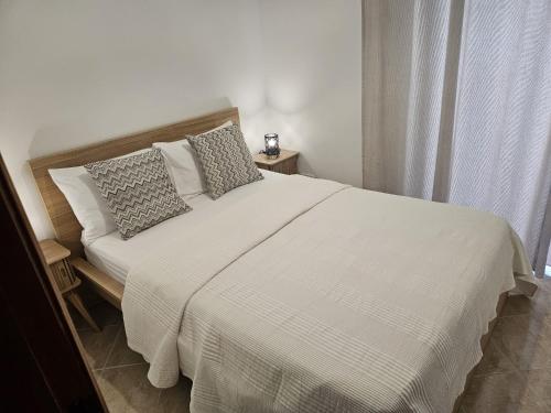 Ένα ή περισσότερα κρεβάτια σε δωμάτιο στο Apartamento Atlantico Tavira