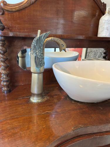 a bathroom counter with a sink and a faucet at The ring fort lodge in Glenties