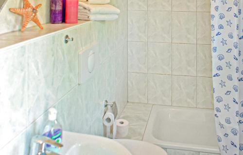 a bathroom with a sink and a toilet at Ferienhaus Verchen in Verchen