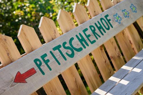 a sign on a wooden fence with the word preference at Pfitscherhof in Campo di Trens