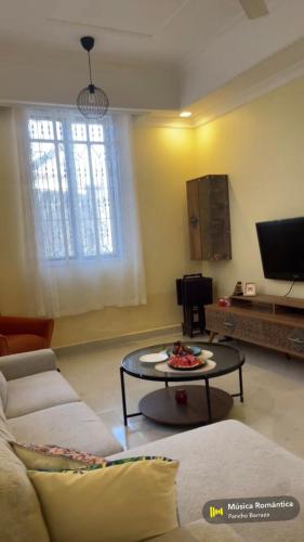 a living room with a couch and a table at Zawash in Chukwani