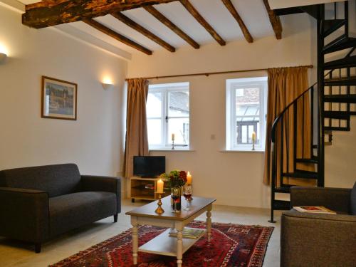 Et opholdsområde på The Grooms Cottage