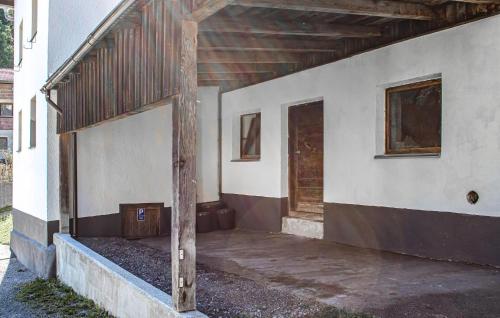 an outside view of a building with a porch at Ferienhaus S' Tobiasa in Schönwies