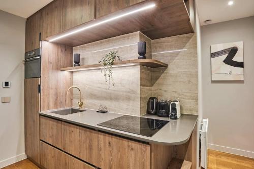 a kitchen with a sink and a counter top at Superb air-conditioned flat on the Champs Elysées in Paris