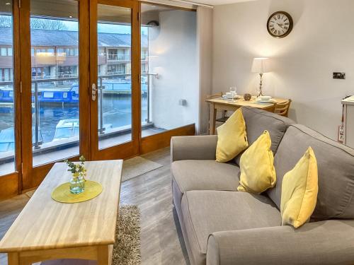 a living room with a couch and a table at Marina Haven in Carnforth