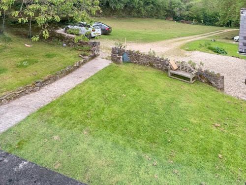 an aerial view of a park with a bench in the grass at Tyn Y Celyn - Uk48801 in Mold
