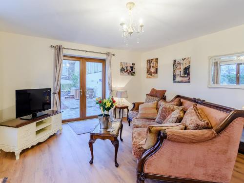 TV a/nebo společenská místnost v ubytování Hayloft- Uk31532