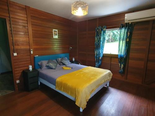 Llit o llits en una habitació de Le Petit Maripa