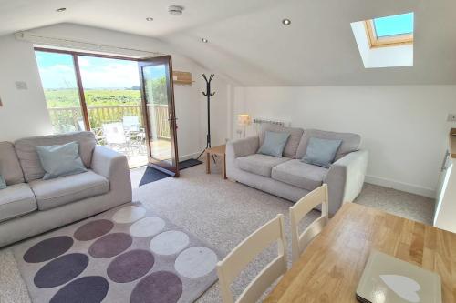 Posezení v ubytování Stable Barn Apartment