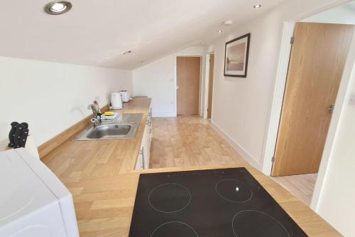 Kuchyň nebo kuchyňský kout v ubytování Stable Barn Apartment
