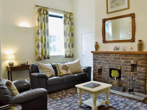 Posezení v ubytování Stable Cottage