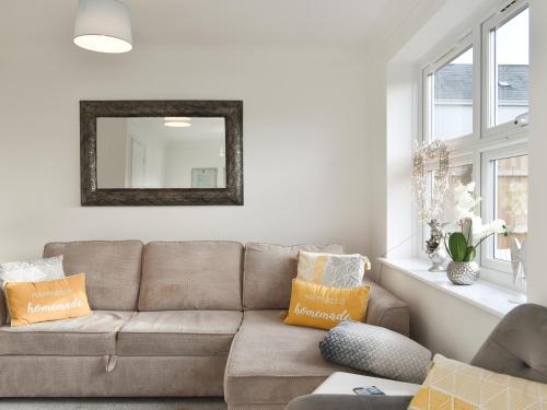 a living room with a couch and a mirror at Apartment 1 - Uk42622 in Poole