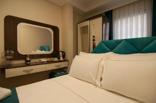Katil atau katil-katil dalam bilik di Akbiyik Suite Boutique Hotel