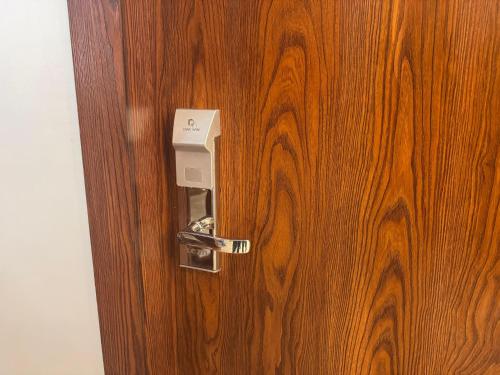 a door with a lock on a wooden door at Palacio Pyramids Hotel in Cairo