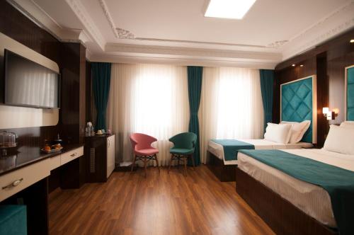 Katil atau katil-katil dalam bilik di Akbiyik Suite Boutique Hotel