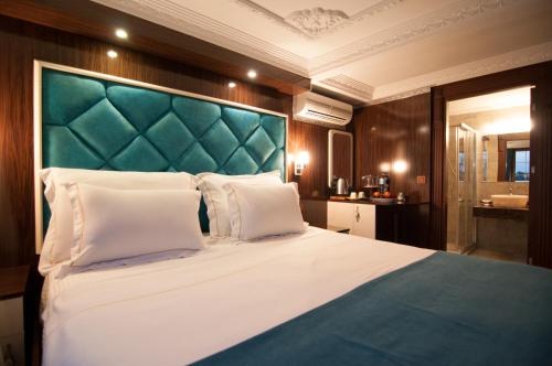 Katil atau katil-katil dalam bilik di Akbiyik Suite Boutique Hotel