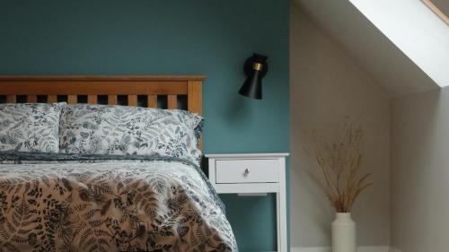 Katil atau katil-katil dalam bilik di Remore Steading - Coachhouse