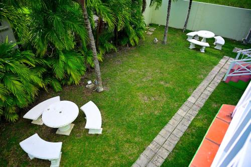 an overhead view of a yard with white tables and benches at Best E Villas Prospect St James in Saint James