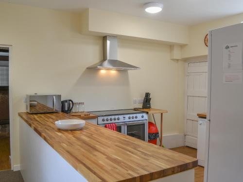 a kitchen with a counter top and a stove at Blaithwaite Stables in Blencogo