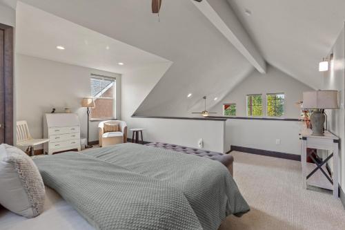 a white bedroom with a bed and a window at 20 Pomrankey Ln in Dover