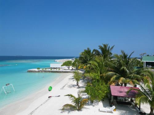 an aerial view of a beach with palm trees and the ocean at Lagoon View in Bodufolhudhoo