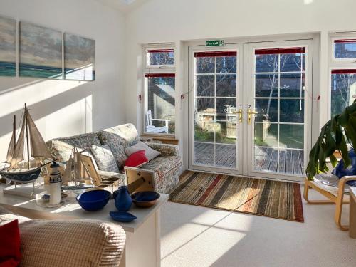 a living room with a couch and a sailboat in it at Bents Retreat in Montrose