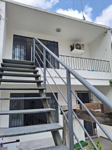a staircase leading up to a white building at Suite 1076 in Belém