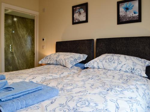 Ένα ή περισσότερα κρεβάτια σε δωμάτιο στο Bluebell Lodge