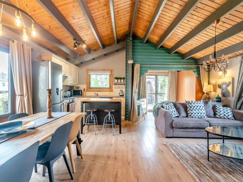 a living room with a couch and a table at 5 The Glades - Uk46753 in Tattershall