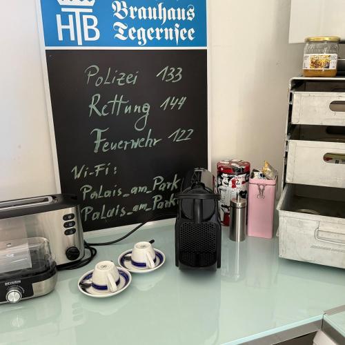 a kitchen counter with a coffee maker on a counter top at Palais am Park in Krems an der Donau