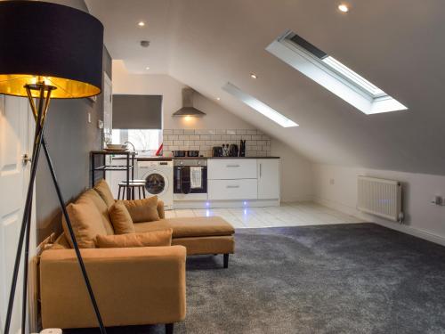a living room with a couch and a kitchen at Apartment 6 - Uk48914 in Huddersfield