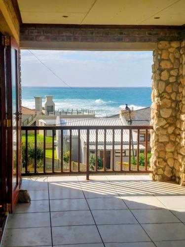 an open balcony with a view of the ocean at C - Views in Jongensfontein