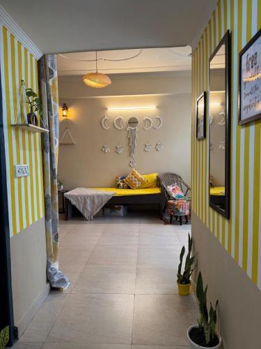 a hallway with a bed in a room at House of Prashakti in Narendranagar