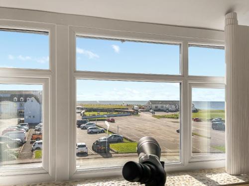 a large window with a view of a parking lot at The St Bees Knees in St Bees
