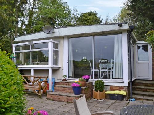 a house with a large sliding glass door at The Summer House in Easthope
