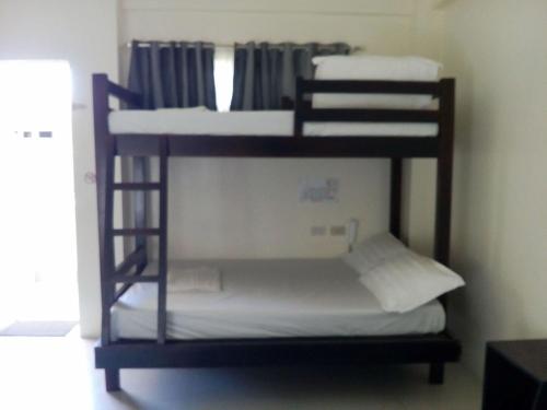 Una cama o camas en una habitación de DaHome Pension