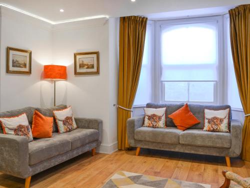 a living room with two couches and a window at The Wharfe - Flat 1 - Uk49411 in York