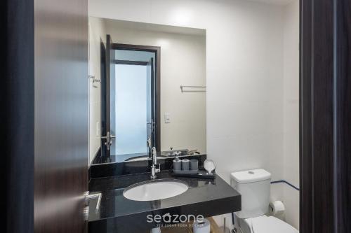 a bathroom with a sink and a toilet at Apto c/ 1 Suíte a 700 m da Praia ELR0507 in Maceió