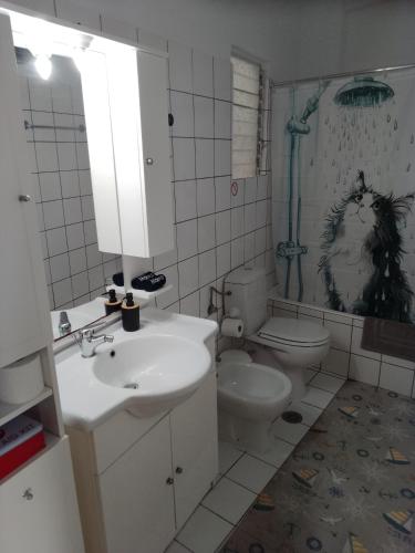 a bathroom with a sink and a toilet at City Apartment Ierapetra 2A in Ierapetra