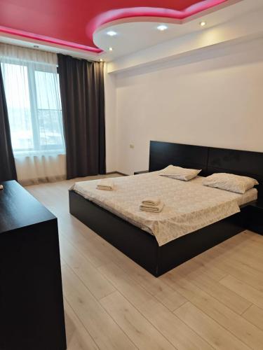 Ένα ή περισσότερα κρεβάτια σε δωμάτιο στο Peak City Residence