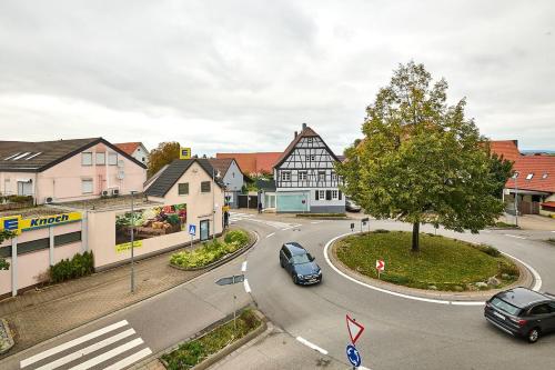 an intersection in a town with cars on the road at Wohlfühlnest in Sankt Leon-Rot