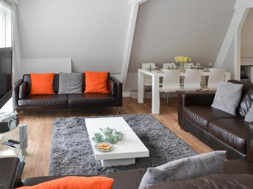 a living room with two couches and a table at Hives - W43108 in Bradworthy