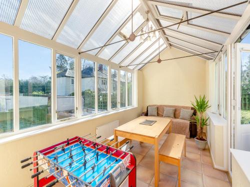 a living room with a ping pong table at The Cottage-Uk37339 in Montgomery