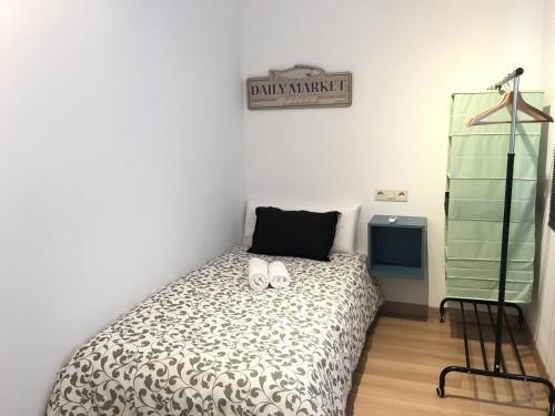 Ein Bett oder Betten in einem Zimmer der Unterkunft Aiguaneu S´Ermita