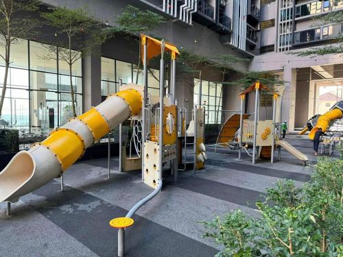 a playground in front of a building with a rocket at Imperio Studio in Malacca